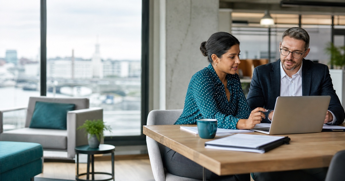 Independent contractor and Irish company formation adviser reviewing a contract and company setup on a laptop